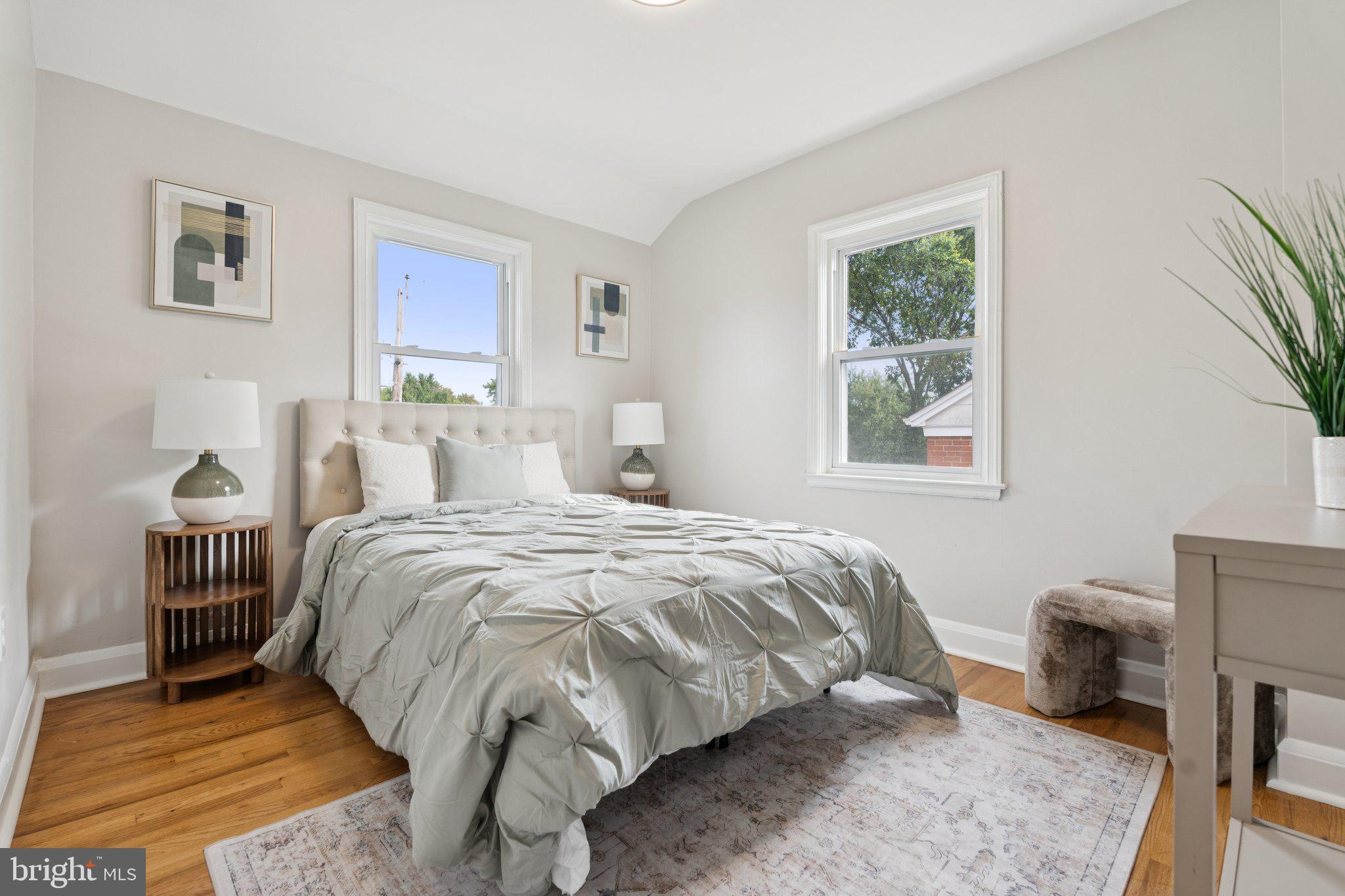 1014 Upnor Road Baltimore, MD 21212 - Photo 15 of 25 a bedroom with a bed and wooden floor