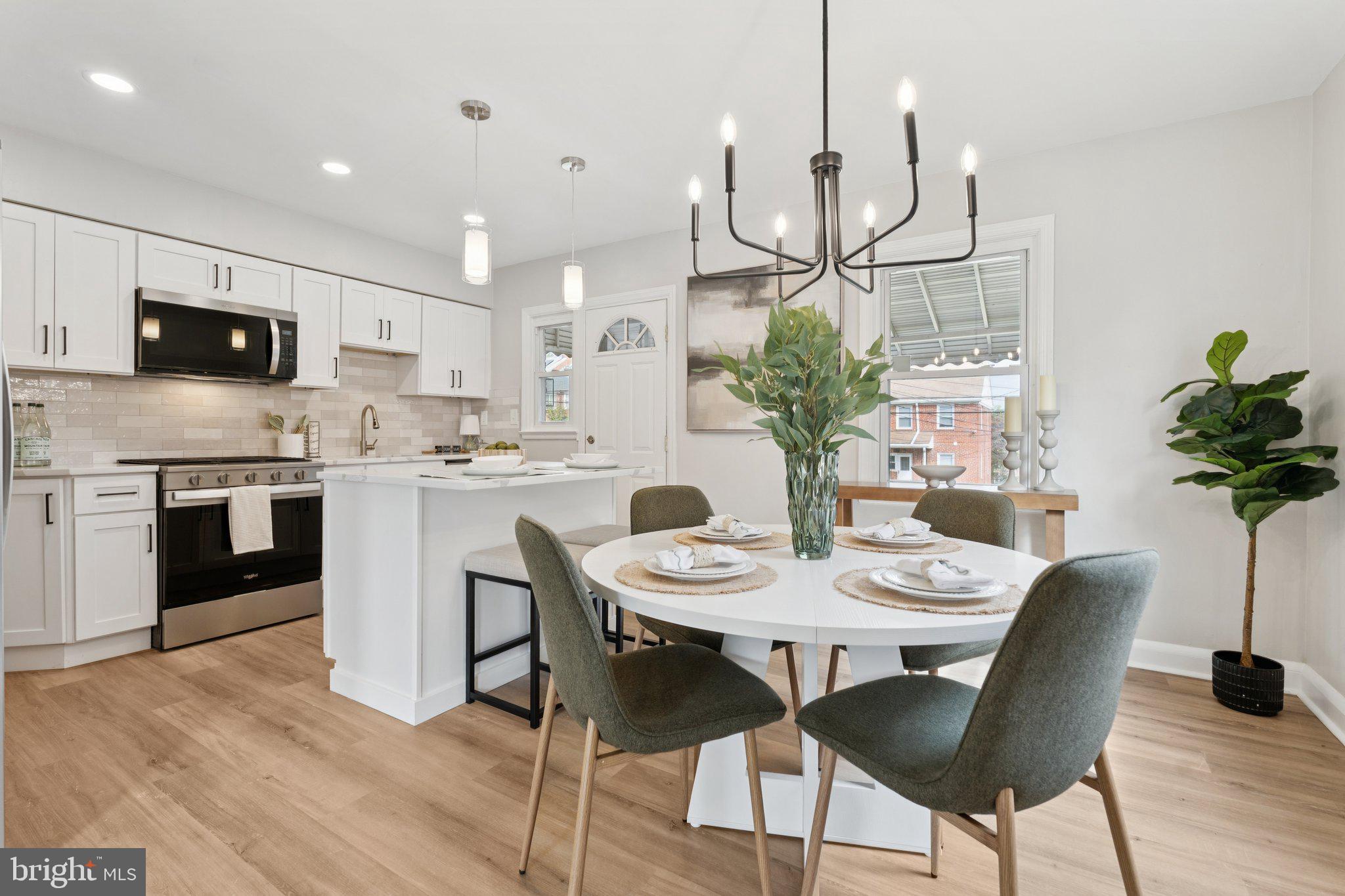 1014 Upnor Road Baltimore, MD 21212 - Photo 4 of 25 a view of a dining room with furniture and wooden floor