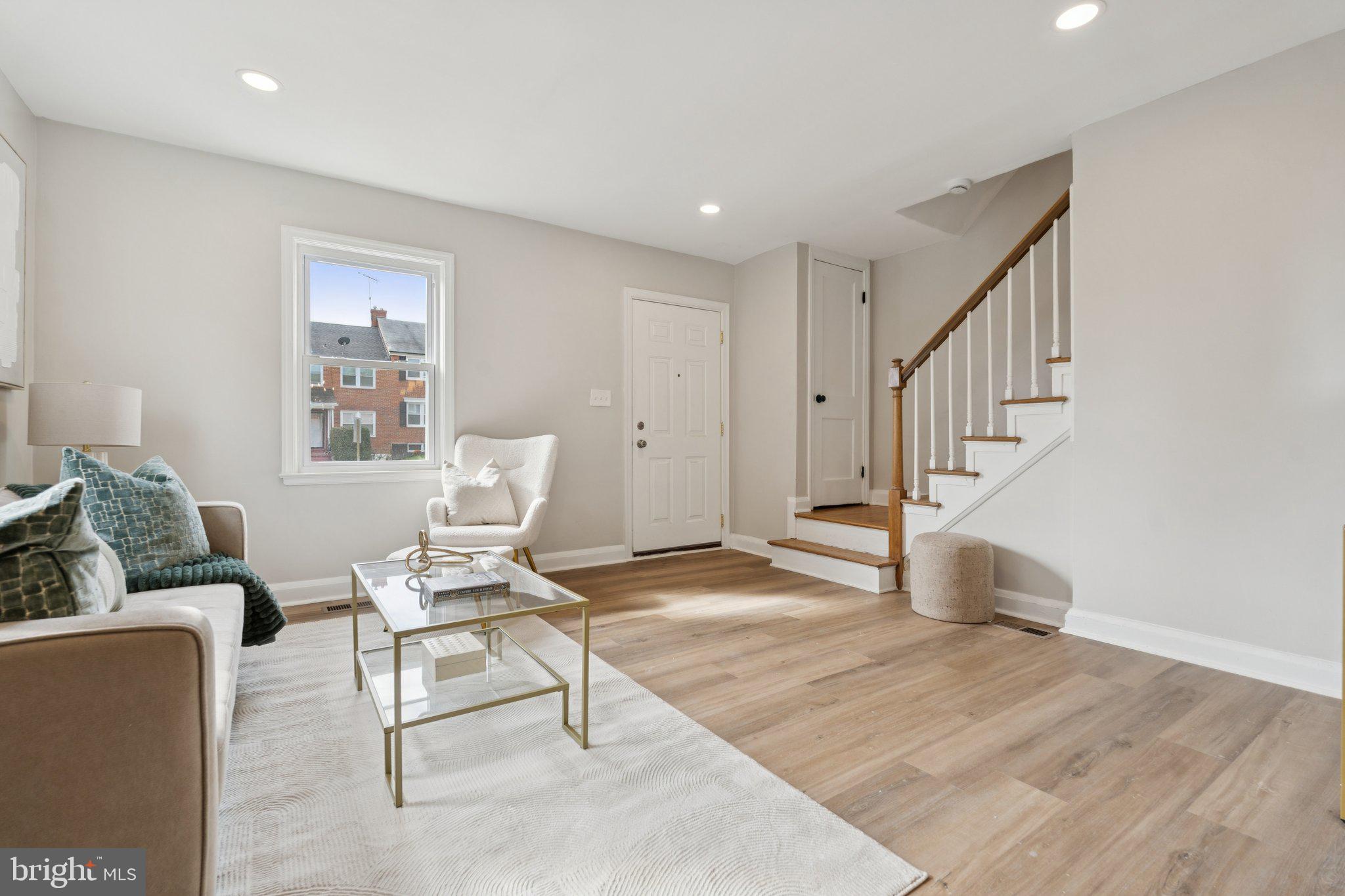 1014 Upnor Road Baltimore, MD 21212 - Photo 10 of 25 a living room with furniture and a wooden floor
