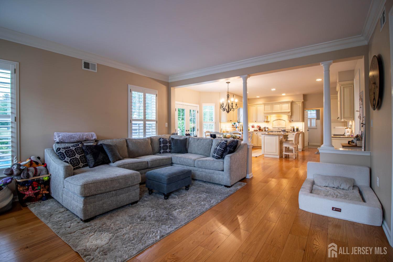 9 Pondview Drive Tinton Falls, NJ 07724 - Photo 13 of 41 a living room with furniture and a large window