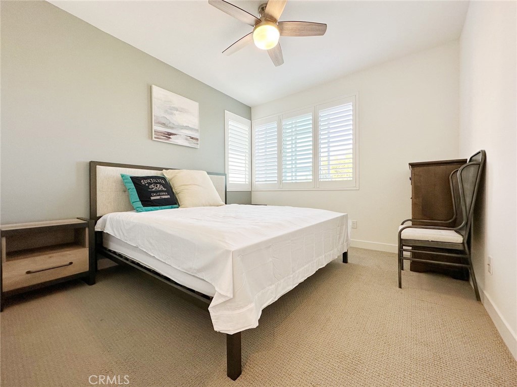 478 Chorus Irvine, CA 92618 - Photo 21 of 33 a bed sitting in a bedroom next to a window
