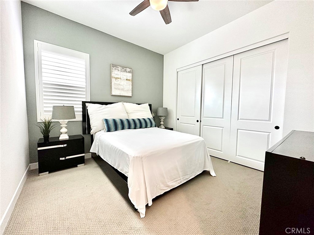 478 Chorus Irvine, CA 92618 - Photo 24 of 33 a bed room with a bed and a ceiling fan