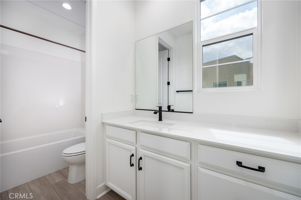478 Chorus Irvine, CA 92618 - Photo 10 of 33 a bathroom with a granite countertop sink a toilet and shower