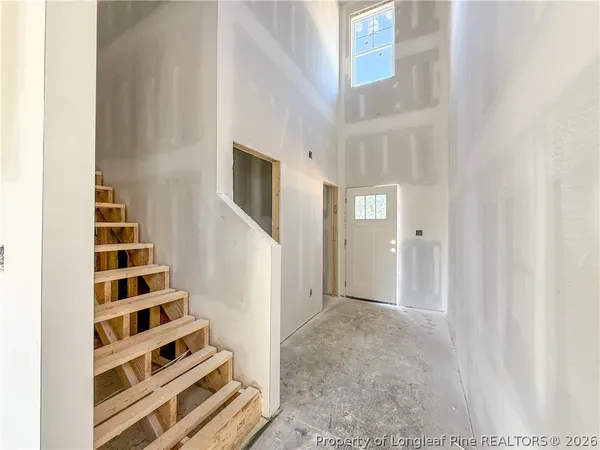 a view of a livingroom with wooden floor and white walls
