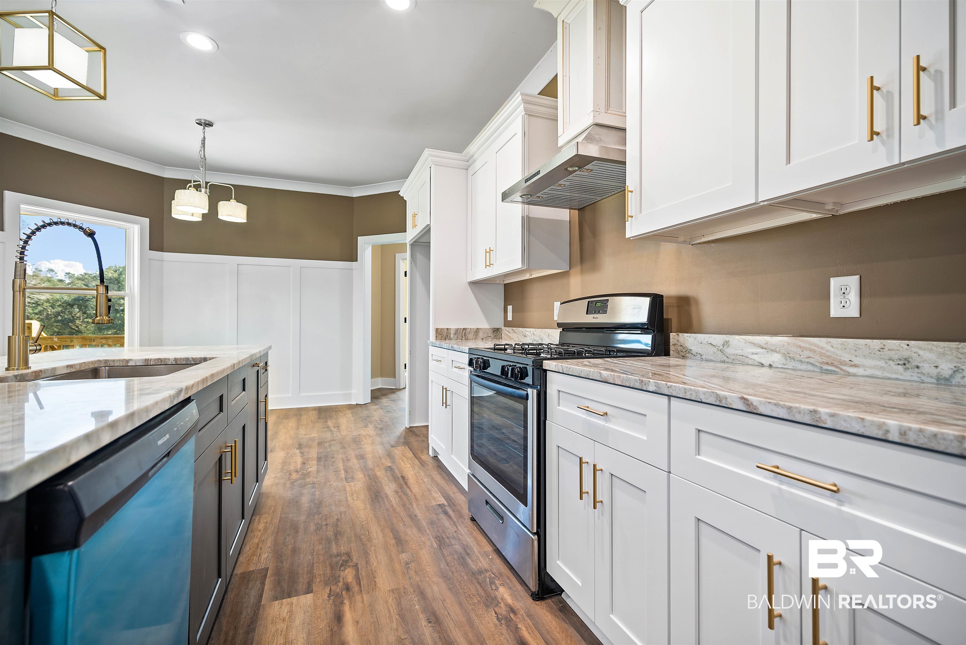 188 Hampton Ridge Mobile, AL 36608 - Photo 9 of 37 Kitchen featuring light granite counters, stainless steel appliances, white cabinets, and pendant lighting.