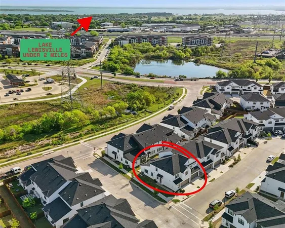 an aerial view of a house with a ocean view