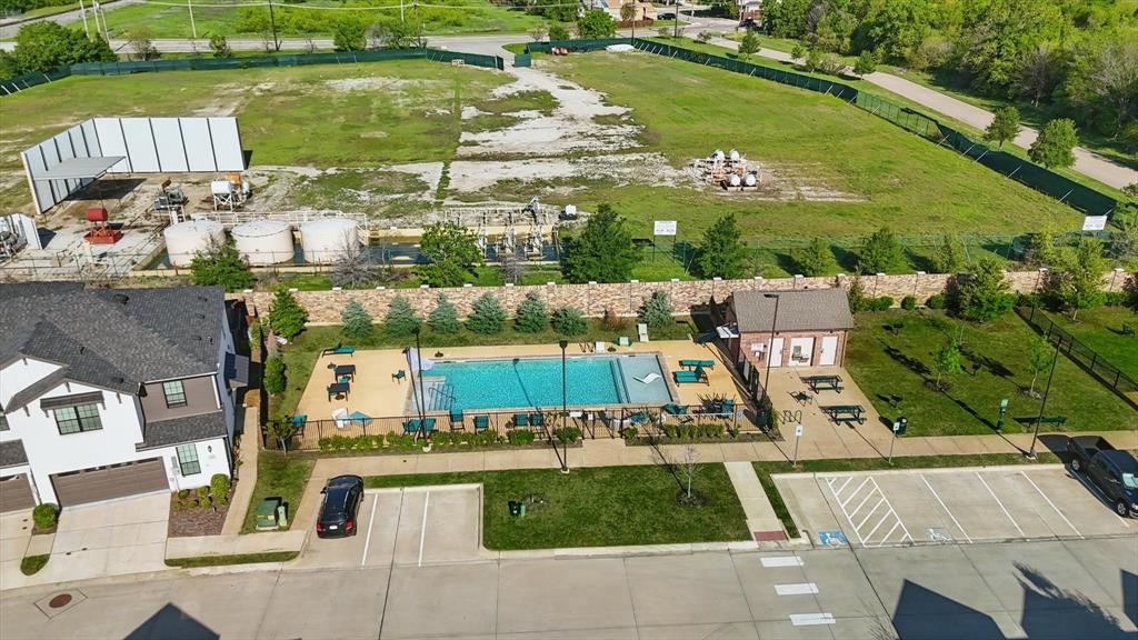 1141 Rusk Way Lewisville, TX 75077 - Photo 17 of 20 an aerial view of a house with a garden and lake view
