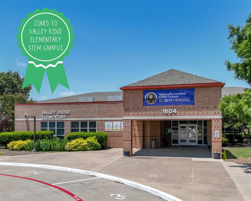 1141 Rusk Way Lewisville, TX 75077 - Photo 19 of 20 a view of a brick building with a large windows