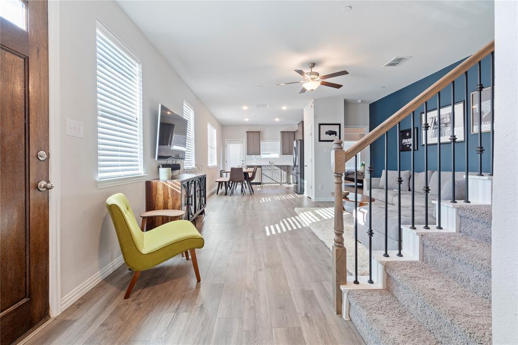 1141 Rusk Way Lewisville, TX 75077 - Photo 4 of 20 a view of a livingroom with furniture wooden floor and a chandelier