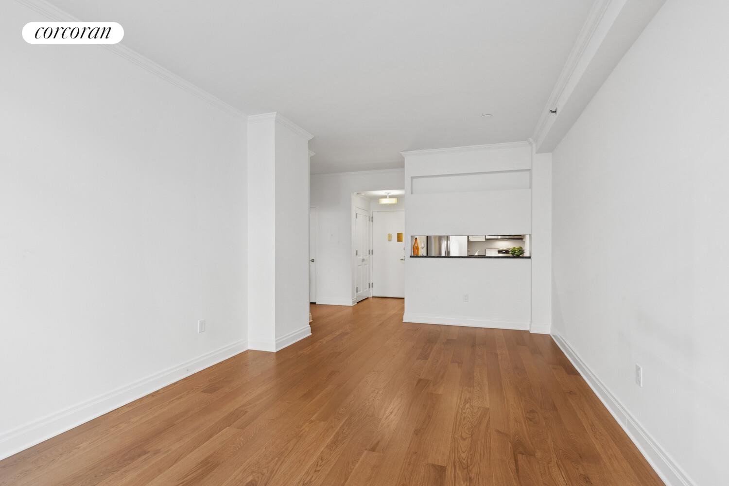 404 East 76th Street, Unit 2J Manhattan, NY 10021 - Photo 2 of 9 a view of kitchen with wooden floor