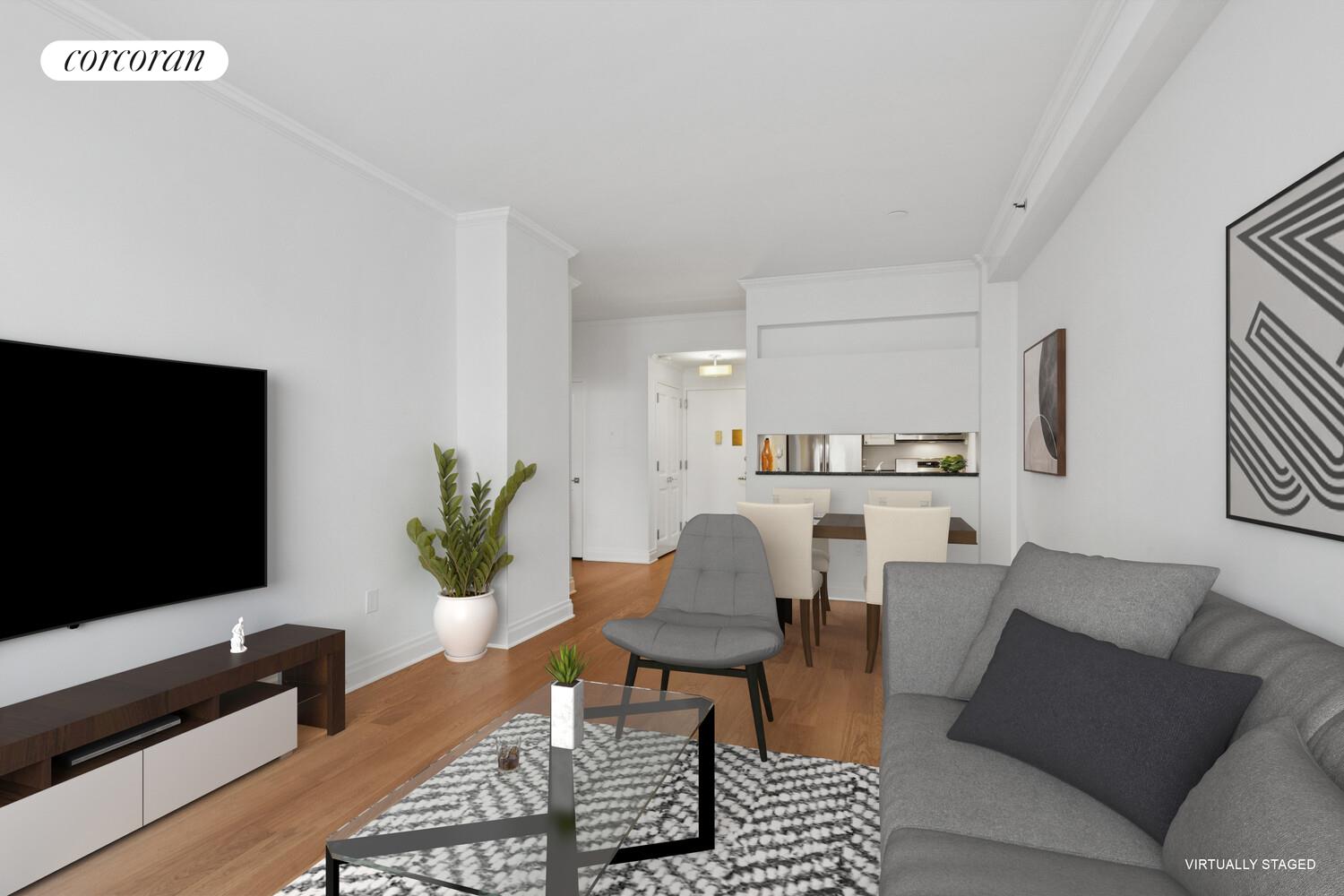 404 East 76th Street, Unit 2J Manhattan, NY 10021 - Photo 7 of 9 a living room with furniture and a flat screen tv