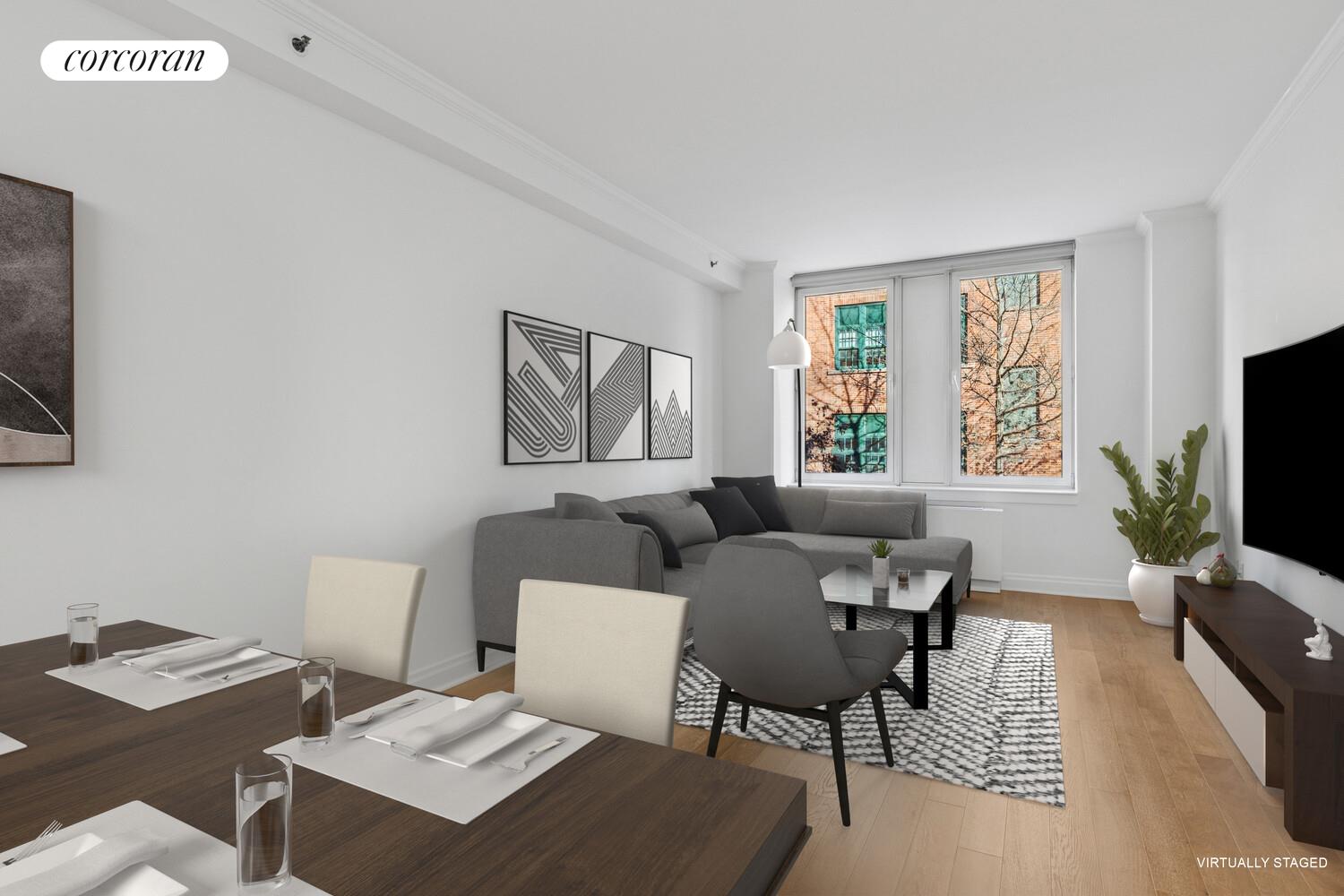 404 East 76th Street, Unit 2J Manhattan, NY 10021 - Photo 8 of 9 a living room with furniture and a flat screen tv