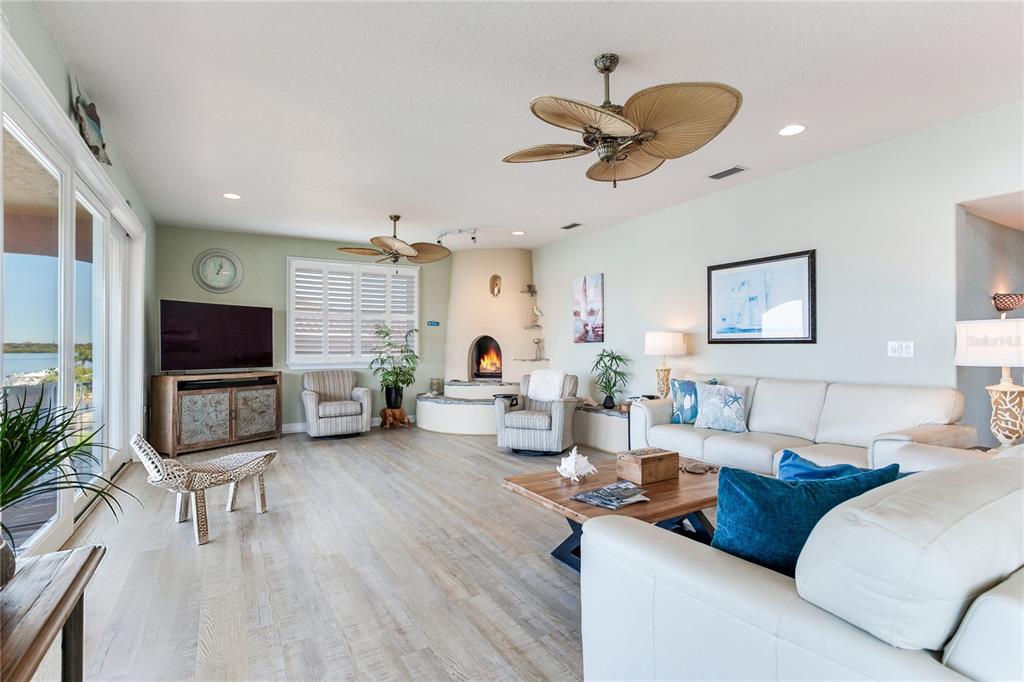 16480 Redington Drive Redington Beach, FL 33708 - Photo 19 of 93 a living room with furniture a flat screen tv and a large window
