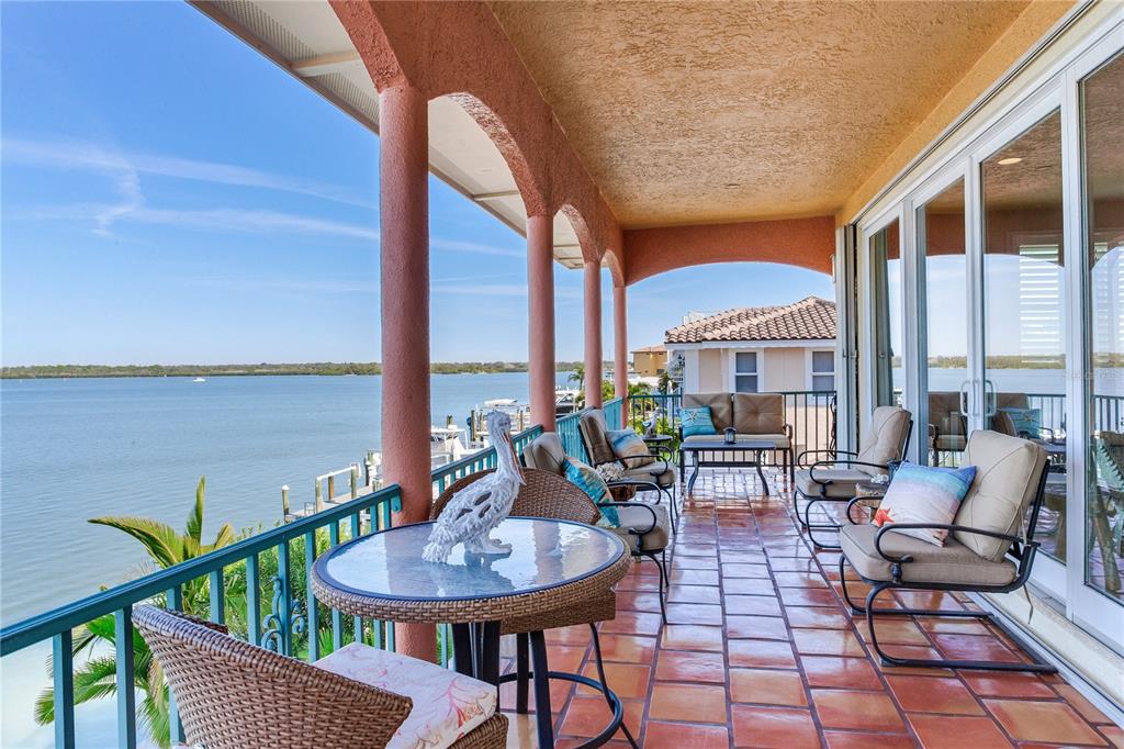 16480 Redington Drive Redington Beach, FL 33708 - Photo 3 of 93 a view of a balcony with chairs and a potted plant