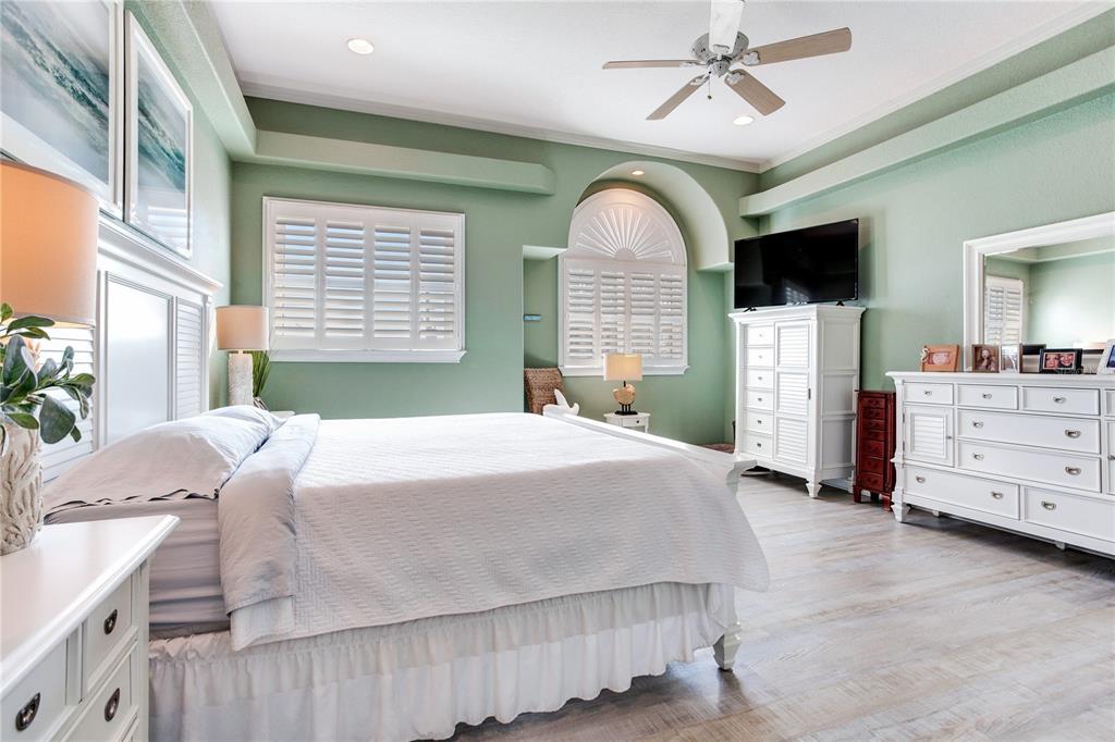 16480 Redington Drive Redington Beach, FL 33708 - Photo 31 of 93 a bedroom with a bed and a dresser