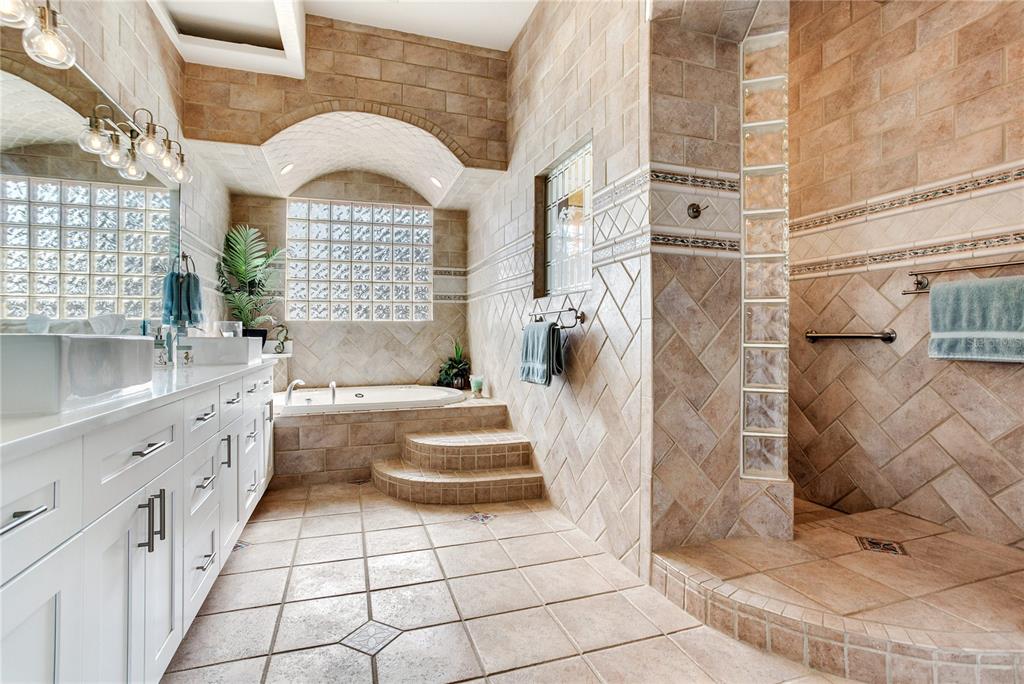 16480 Redington Drive Redington Beach, FL 33708 - Photo 32 of 93 a bathroom with a sink a vanity and a shower