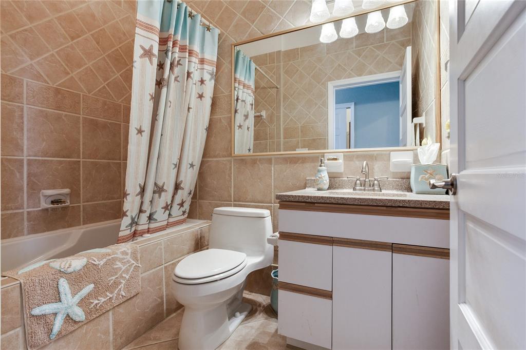 16480 Redington Drive Redington Beach, FL 33708 - Photo 37 of 93 a bathroom with a sink a toilet and shower
