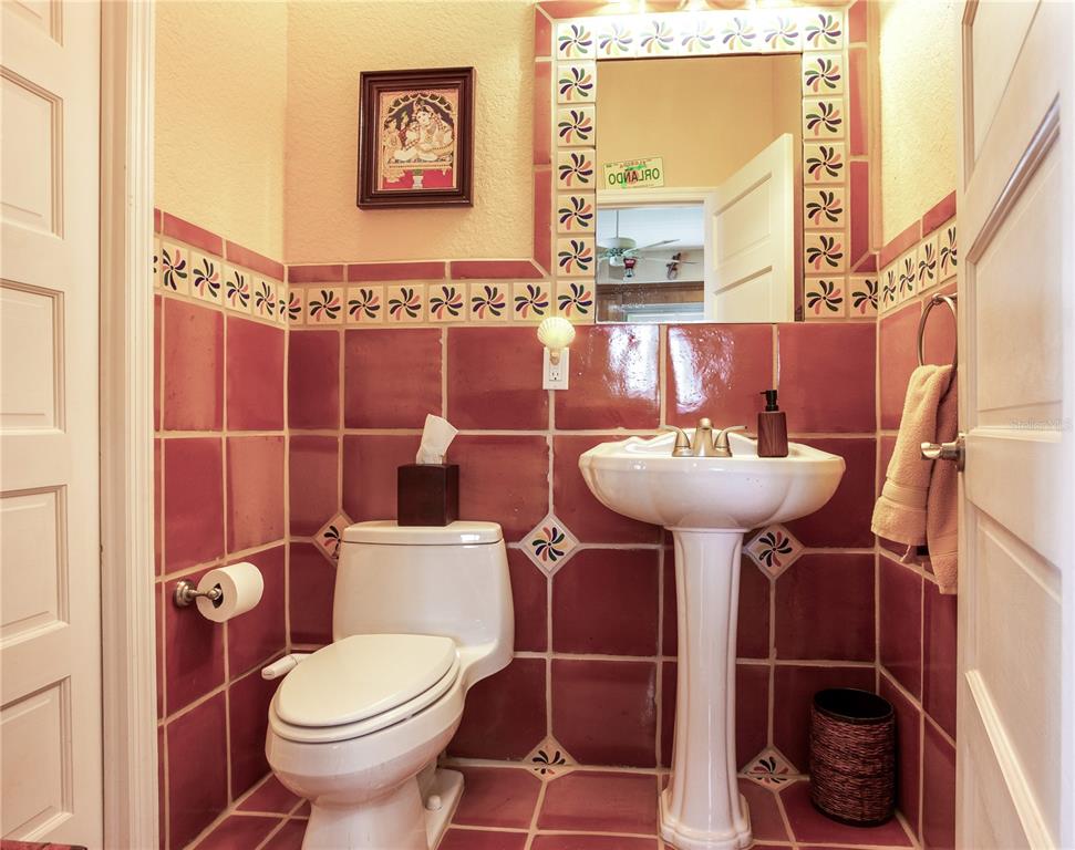 16480 Redington Drive Redington Beach, FL 33708 - Photo 49 of 93 a bathroom with a sink toilet and a mirror