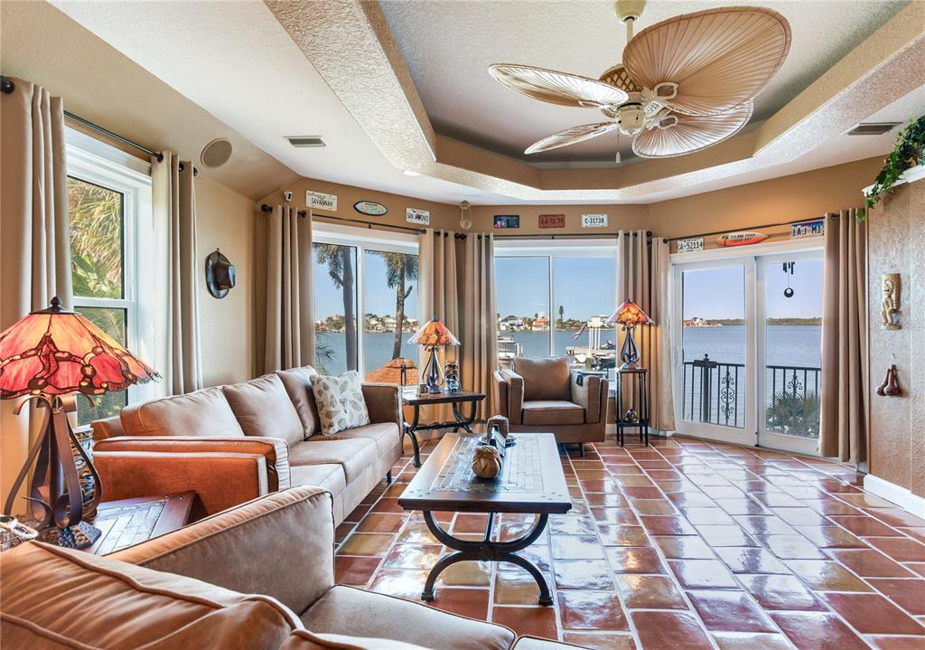 16480 Redington Drive Redington Beach, FL 33708 - Photo 51 of 93 a living room with furniture and a chandelier