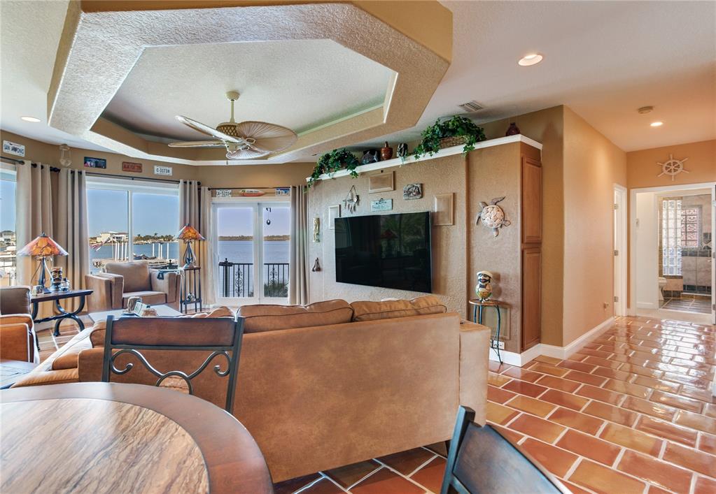 16480 Redington Drive Redington Beach, FL 33708 - Photo 56 of 93 a living room with furniture and a flat screen tv
