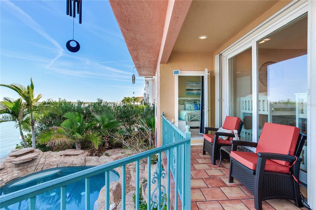 16480 Redington Drive Redington Beach, FL 33708 - Photo 57 of 93 a balcony with furniture and a potted plant