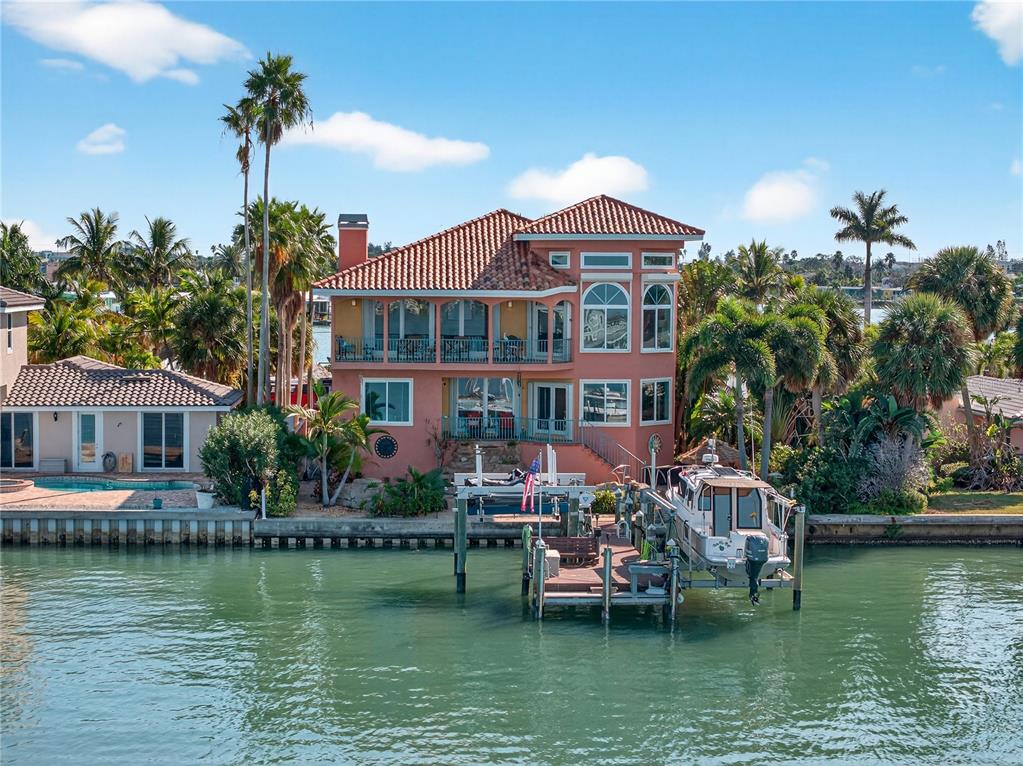 16480 Redington Drive Redington Beach, FL 33708 - Photo 71 of 93 a front view of a house with lots of trees in it