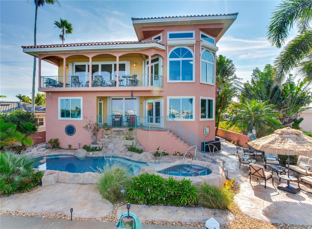 16480 Redington Drive Redington Beach, FL 33708 - Photo 78 of 93 a front view of a house with a yard