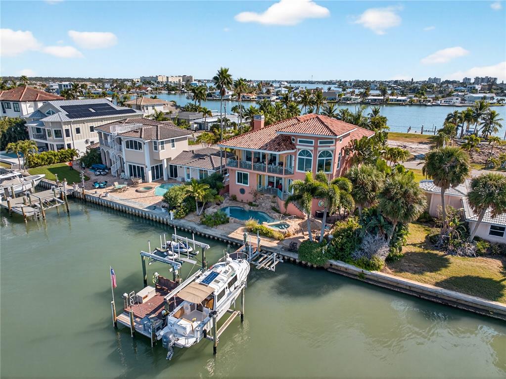 16480 Redington Drive Redington Beach, FL 33708 - Photo 83 of 93 a view of a lake with a table and chairs