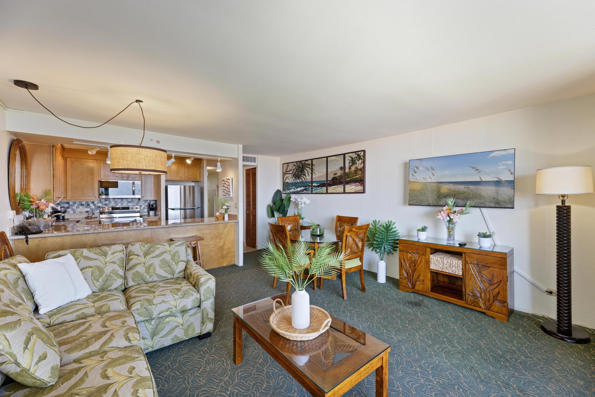 3445 Lower Honoapiilani Road, Unit 826 Lahaina, HI 96761 - Photo 6 of 26 a living room with furniture and a wooden floor