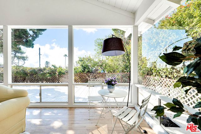 a view of livingroom with furniture and windows