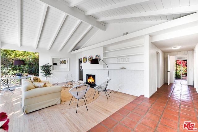 a kitchen with a sink cabinets and window