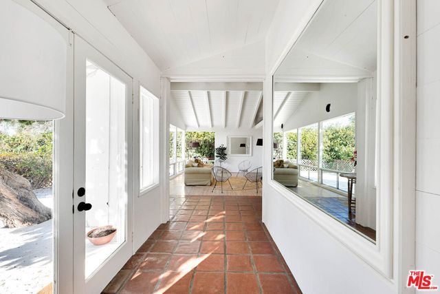 a kitchen with stainless steel appliances granite countertop a sink and a refrigerator