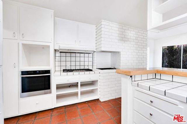 a bedroom with bed and a window