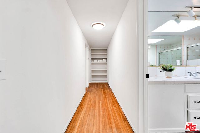 a bedroom with a bed and a rug