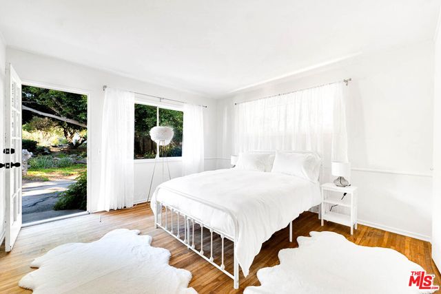 a view of room with wooden floor