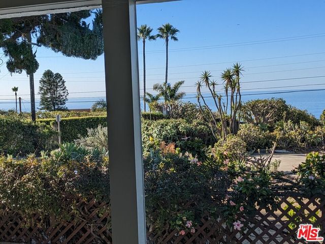 a view of a living room and a floor to ceiling window