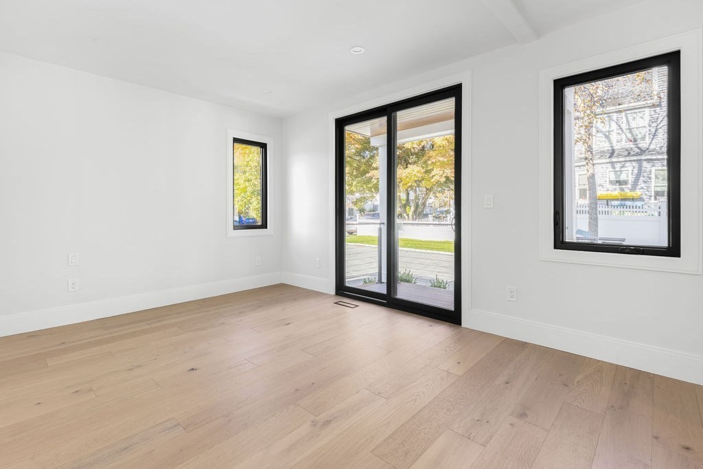 265-267 River Street, Unit 267 Newton, MA 02465 - Photo 11 of 22 an empty room with windows