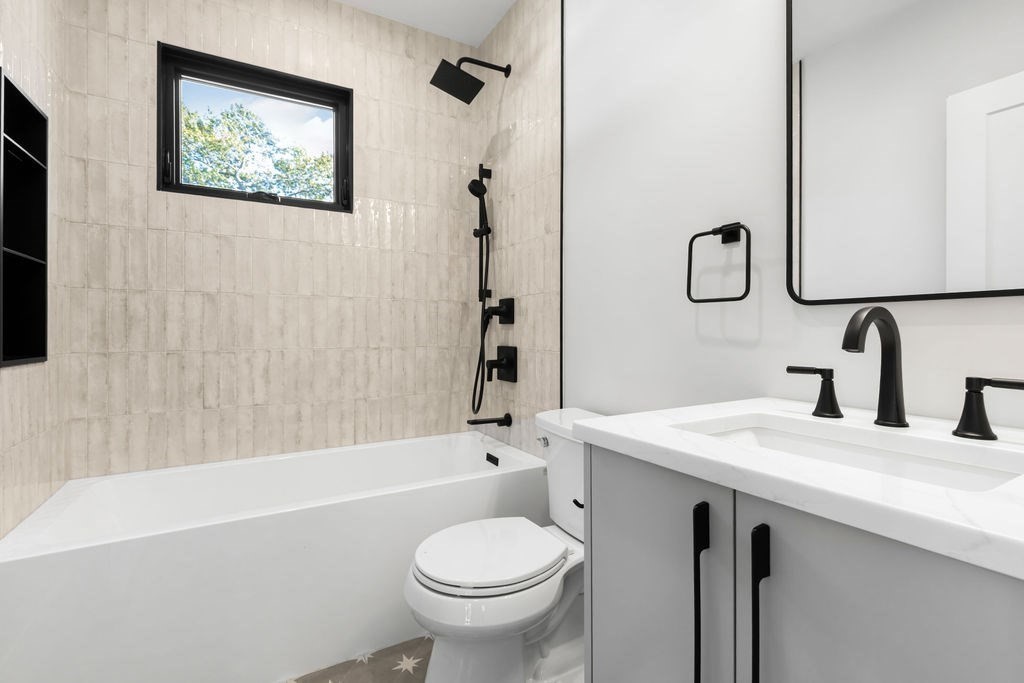 265-267 River Street, Unit 267 Newton, MA 02465 - Photo 13 of 22 a bathroom with a sink a toilet and shower