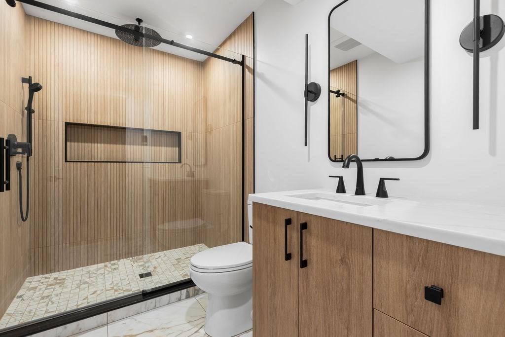 265-267 River Street, Unit 267 Newton, MA 02465 - Photo 20 of 22 a bathroom with a sink a toilet and shower