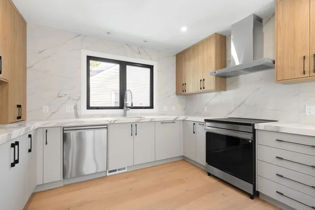 a view of a kitchen with electric appliances