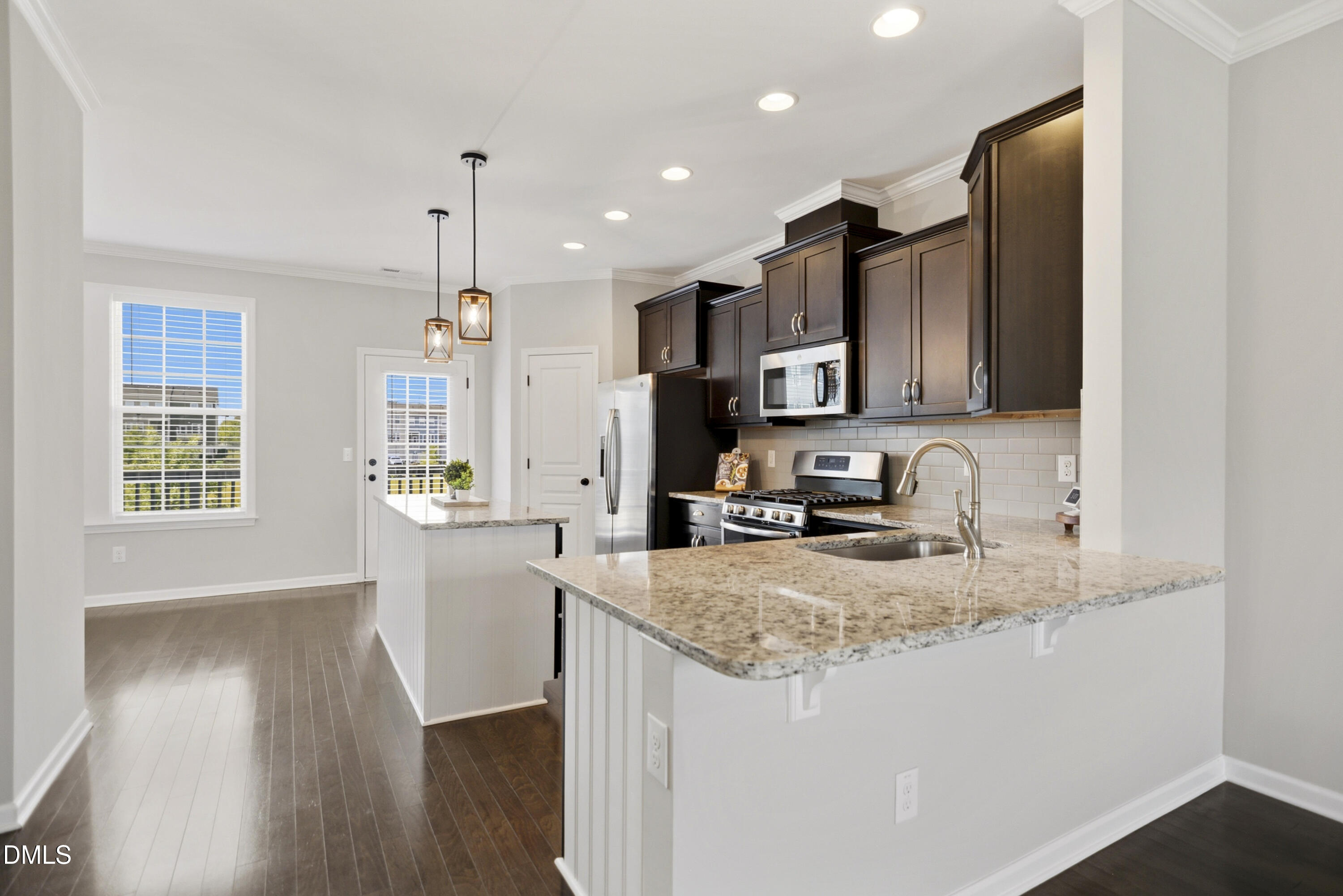 5916 Giddings Street Raleigh, NC 27616 - Photo 8 of 49 a kitchen with sink a microwave and refrigerator