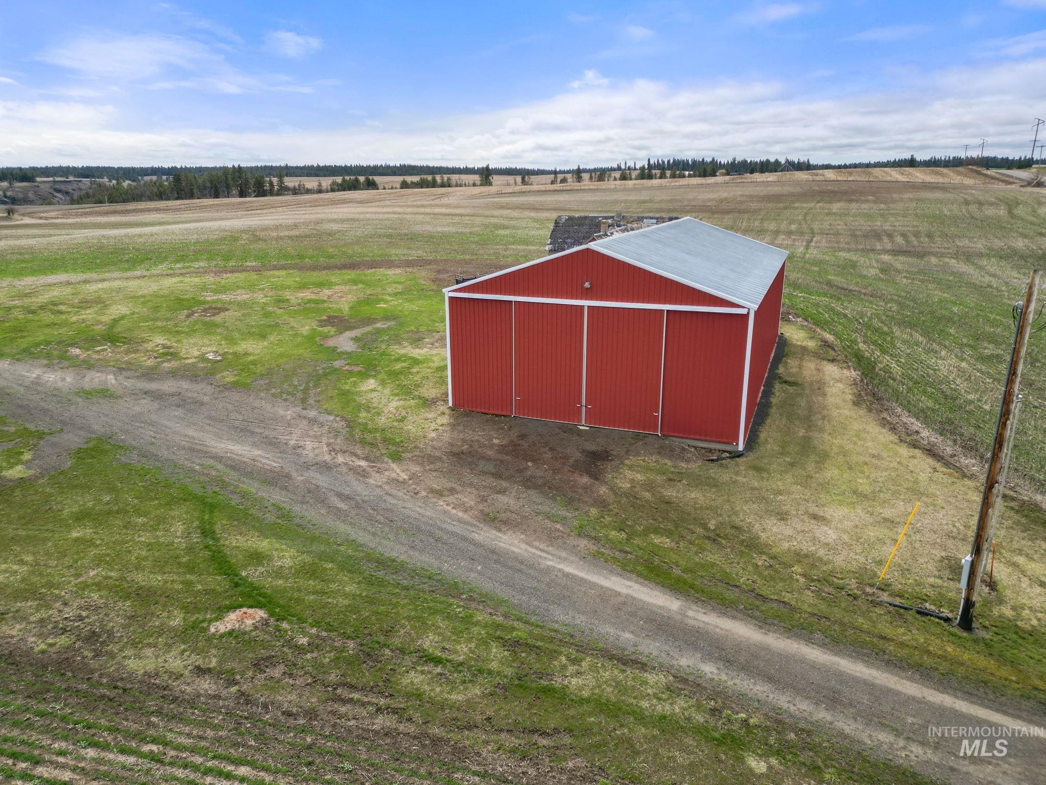 2326 Reubens Road Reubens, ID 83548 - Photo 8 of 34 View of pole building featuring a view of countryside and a yard