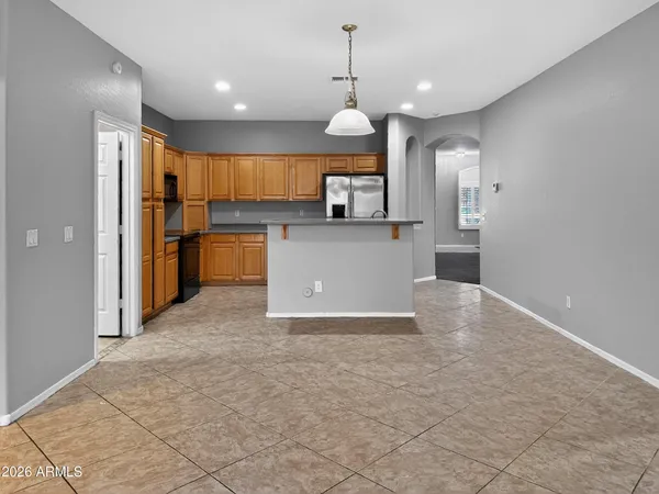 a kitchen with stainless steel appliances granite countertop a stove microwave and sink