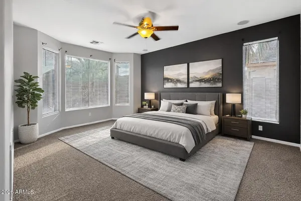 a view of a livingroom with a ceiling fan and window