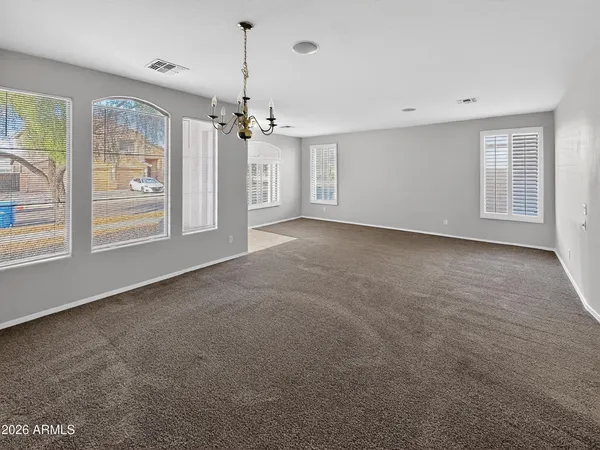 a kitchen with stainless steel appliances granite countertop a refrigerator a stove a sink a microwave and island