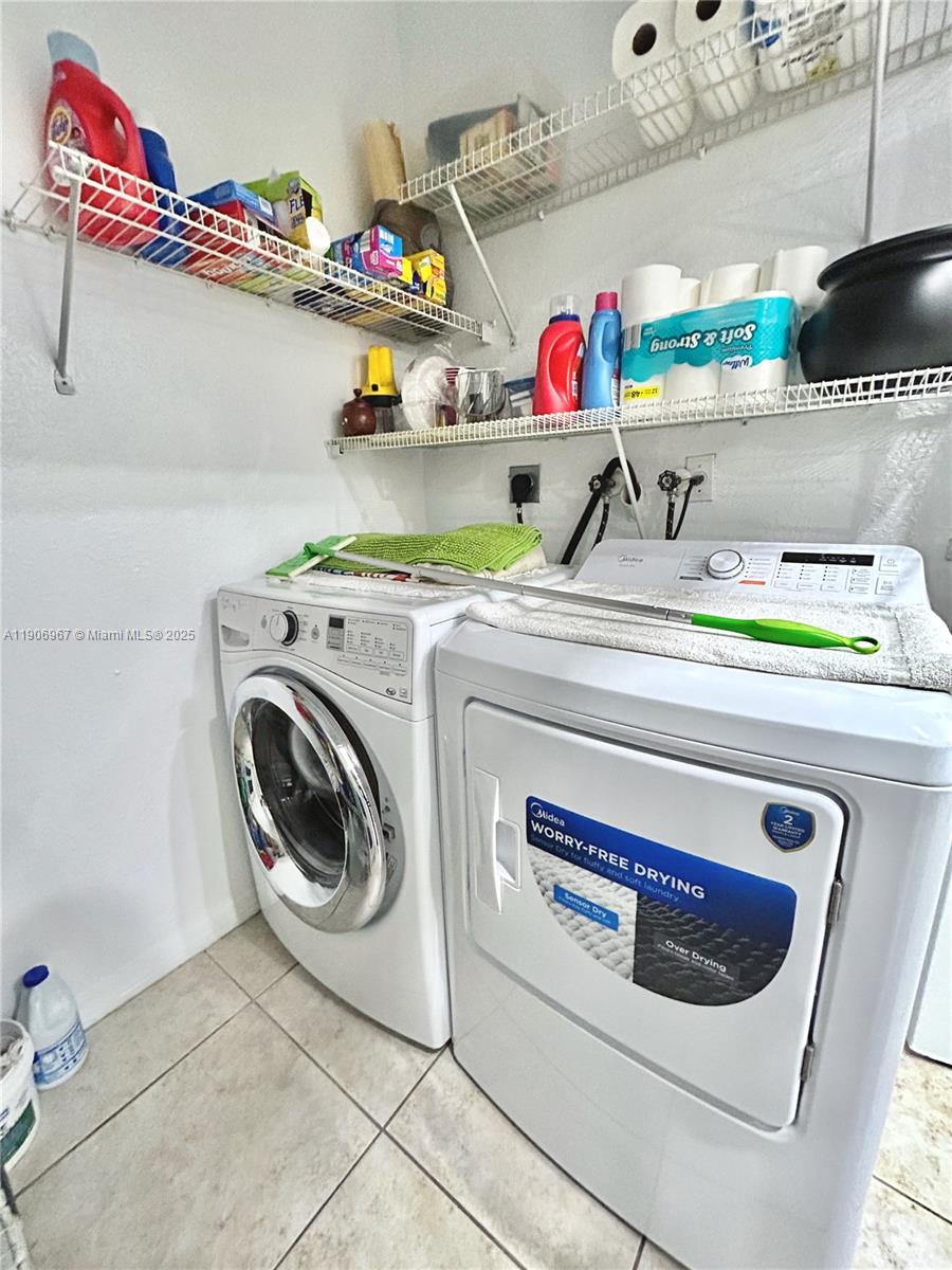 13778 Southwest 170th Lane Miami, FL 33177 - Photo 19 of 23 a utility room with dryer and washer