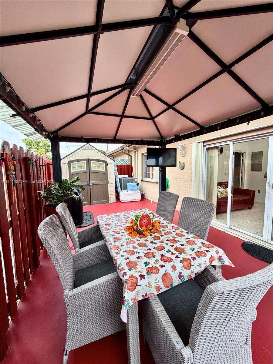 13778 Southwest 170th Lane Miami, FL 33177 - Photo 21 of 23 a outdoor space with the couches and dining table