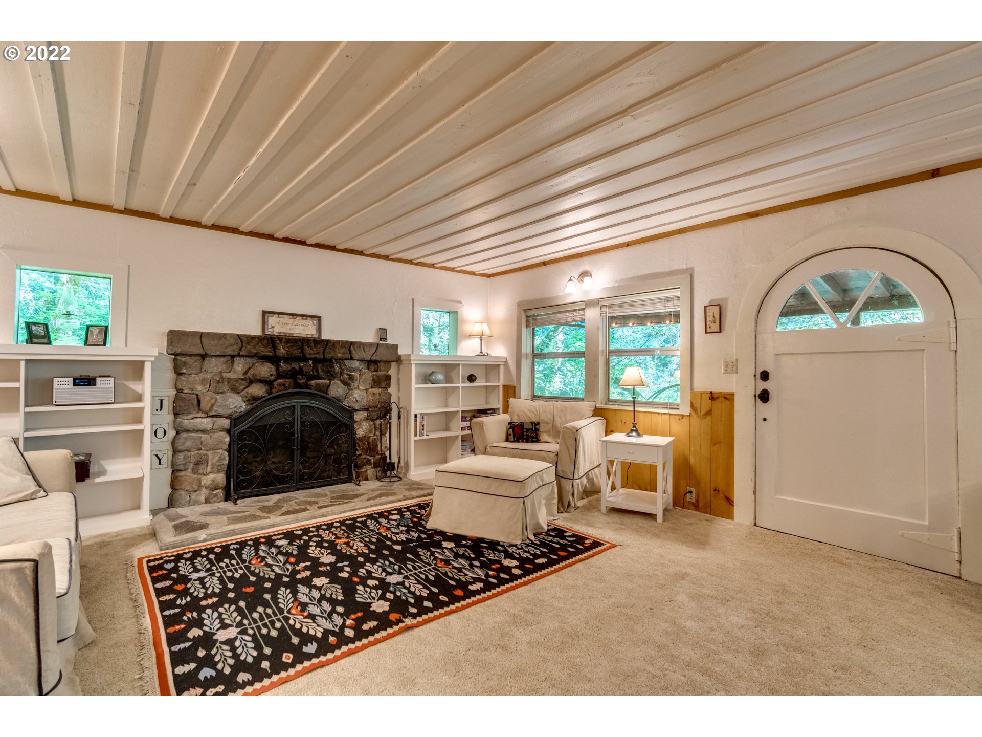 29018 Road 20, Unit LOT67 Rhododendron, OR 97049 - Photo 10 of 31 a living room with furniture a fireplace and a flat screen tv
