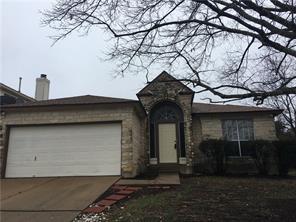 A classic brick and stone facade welcomes you to this inviting home with a spacious attached garage.