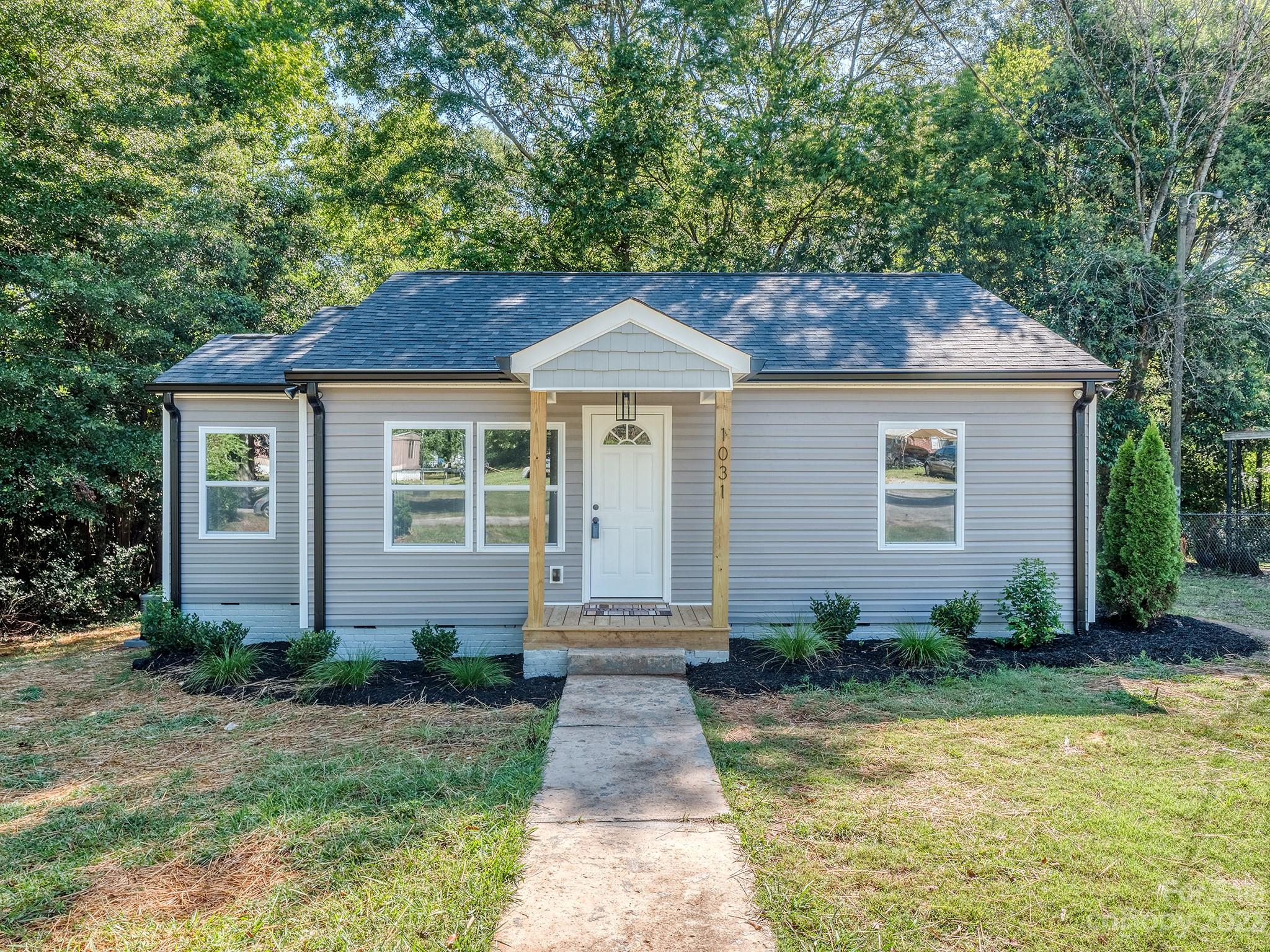 1031 State Rd S-29-424 Lancaster, SC 29720 - Photo 1 of 47 a front view of a house with a yard